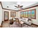 Cozy living room with tile floors, wood trim, comfortable seating, and plantation shutters at 600 Brechin Dr, Winter Park, FL 32792