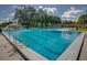 A clean, well maintained community swimming pool with clear blue water and surrounding deck at 600 Brechin Dr, Winter Park, FL 32792