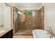 Bathroom featuring a spacious tiled walk-in shower with window at 600 Brechin Dr, Winter Park, FL 32792