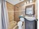 Bathroom featuring tiled shower, vanity with sink, and a toilet at 62 York Ct, Kissimmee, FL 34758