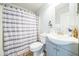 Neutral bathroom featuring modern fixtures, including vanity sink, toilet, and shower at 62 York Ct, Kissimmee, FL 34758