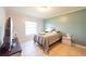 Comfortable bedroom featuring ample natural light and tile flooring at 62 York Ct, Kissimmee, FL 34758