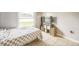 Neat bedroom with tile flooring, a storage unit, and view of the lawn at 62 York Ct, Kissimmee, FL 34758