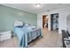 Well lit bedroom with tile floors and a full en suite bathroom and walk in closet at 62 York Ct, Kissimmee, FL 34758