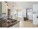 Clean kitchen with tiled flooring, ample natural light and granite countertops at 62 York Ct, Kissimmee, FL 34758