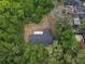 Aerial view shows a home surrounded by dense foliage, providing a sense of privacy and seclusion at 633 Hermits Trail, Altamonte Springs, FL 32701