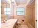 Standard bathroom featuring a single sink vanity, window, and tile bath and shower combo at 633 Hermits Trail, Altamonte Springs, FL 32701