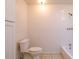 Bathroom featuring a toilet, white tub, shower and tile flooring at 633 Hermits Trail, Altamonte Springs, FL 32701