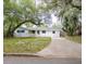 Charming single-story home with a long driveway and beautiful mature trees at 633 Hermits Trail, Altamonte Springs, FL 32701