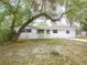 Single-story home featuring a well-maintained lawn and mature trees at 633 Hermits Trail, Altamonte Springs, FL 32701