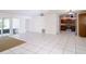 Bright, open-concept living space with tile floors and sliding door to outdoor patio at 633 Hermits Trail, Altamonte Springs, FL 32701
