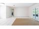 Large and bright living space featuring white walls, tile floors, and sliding glass doors at 633 Hermits Trail, Altamonte Springs, FL 32701