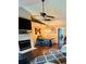 Bright dining area with hardwood floors, a farmhouse style table, and decorative lighting fixtures at 651 Holbrook Cir, Lake Mary, FL 32746