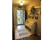 Welcoming entryway with tile flooring, a decorative bench, and 