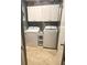 Convenient laundry room equipped with washer, dryer, and white cabinets for storage at 651 Holbrook Cir, Lake Mary, FL 32746