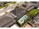 Aerial view of the backyard featuring a pool, spa, and meticulously landscaped outdoor space at 8109 Ludington Cir, Orlando, FL 32836