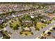 Community aerial view features single-Gathering homes, lush landscaping, a lake, and a community center with a pool and playground at 8109 Ludington Cir, Orlando, FL 32836