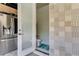 Conveniently located bathroom with stylish tile accents, providing comfort and functionality for outdoor gatherings at 8109 Ludington Cir, Orlando, FL 32836