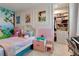 Charming bedroom featuring fairytale princess decor, a cozy bed, and a walk-in closet at 8109 Ludington Cir, Orlando, FL 32836