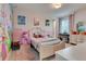 Adorable bedroom featuring fairytale princess decor, a cozy bed, and whimsical wall art at 8109 Ludington Cir, Orlando, FL 32836