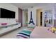 Bedroom featuring decor wall art, modern shelving, and an open closet offering a tidy space at 8109 Ludington Cir, Orlando, FL 32836
