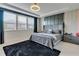 Beautifully decorated bedroom featuring a luxurious bed, stylish decor, and plenty of natural light from the large windows at 8109 Ludington Cir, Orlando, FL 32836
