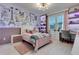 Charming bedroom featuring Paris themed decor, a cozy bed, desk, and ample natural light at 8109 Ludington Cir, Orlando, FL 32836