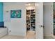 Walk-in closet featuring custom shelving and ample storage space, providing organized convenience at 8109 Ludington Cir, Orlando, FL 32836