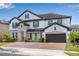 Beautiful two-story home featuring a brick driveway and stone accents, along with a two car garage at 8109 Ludington Cir, Orlando, FL 32836