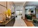 Elegant foyer featuring modern decor, tile flooring, and a glimpse into the stylish living spaces beyond at 8109 Ludington Cir, Orlando, FL 32836