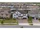 Two-story home with a well-manicured lawn, a paver driveway, a two-car garage, and mature trees in a suburban setting at 8109 Ludington Cir, Orlando, FL 32836