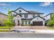 Two-story home featuring a stone facade, a two-car garage, and a brick paver driveway in a suburban setting at 8109 Ludington Cir, Orlando, FL 32836