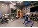 This home gym features free weights, weight machines, treadmills, and storage cabinets at 8109 Ludington Cir, Orlando, FL 32836