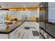 Well-lit kitchen featuring a sleek island, modern appliances, and elegant finishes, perfect for culinary enthusiasts at 8109 Ludington Cir, Orlando, FL 32836