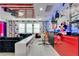 This living room is decorated with custom Mickey Mouse and movie-themed decor throughout at 8109 Ludington Cir, Orlando, FL 32836
