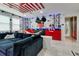 This is a living room decorated with Mickey Mouse themed wallpaper and accents at 8109 Ludington Cir, Orlando, FL 32836