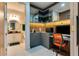 Modern office space with built-in shelving and storage, adjacent to a half-bathroom, perfect for work from home at 8109 Ludington Cir, Orlando, FL 32836