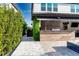 Outdoor entertaining area with a complete summer kitchen, ideal for hosting barbecues and enjoying outdoor living at 8109 Ludington Cir, Orlando, FL 32836