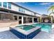Inviting backyard featuring a sparkling pool, spa, covered patio, and lush landscaping, great for outdoor living at 8109 Ludington Cir, Orlando, FL 32836