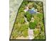 Captivating aerial view showcasing the home's location nestled among lush trees and the expansive property at 840 Dyson Dr, Winter Springs, FL 32708
