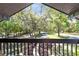 Scenic balcony view overlooking lush greenery and mature trees providing a serene outdoor experience at 840 Dyson Dr, Winter Springs, FL 32708