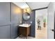 Tastefully designed bathroom featuring a wooden vanity and classic gold fixtures at 840 Dyson Dr, Winter Springs, FL 32708