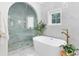 Elegant bathroom featuring a freestanding tub, glass shower, and marble countertops at 840 Dyson Dr, Winter Springs, FL 32708