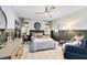 This is a comfortably decorated bedroom featuring a ceiling fan and plaid carpet at 840 Dyson Dr, Winter Springs, FL 32708