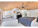 Large bedroom with a wood ceiling, adjacent office, and oversized windows with views at 840 Dyson Dr, Winter Springs, FL 32708