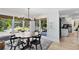 Sunlit dining area overlooks a well-manicured backyard and outdoor entertainment area at 840 Dyson Dr, Winter Springs, FL 32708