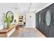 Foyer featuring hardwood floors, statement mirror, wooden table and front doors at 840 Dyson Dr, Winter Springs, FL 32708