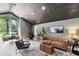 Comfortable living room with hardwood floors, a vaulted ceiling, and a view of the yard at 840 Dyson Dr, Winter Springs, FL 32708