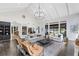 Spacious living room with high ceilings, ample seating, modern light fixture and dark hardwood floors at 840 Dyson Dr, Winter Springs, FL 32708