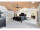 This main bedroom boasts wood plank ceilings, plush carpets, and an adjoining bathroom at 840 Dyson Dr, Winter Springs, FL 32708